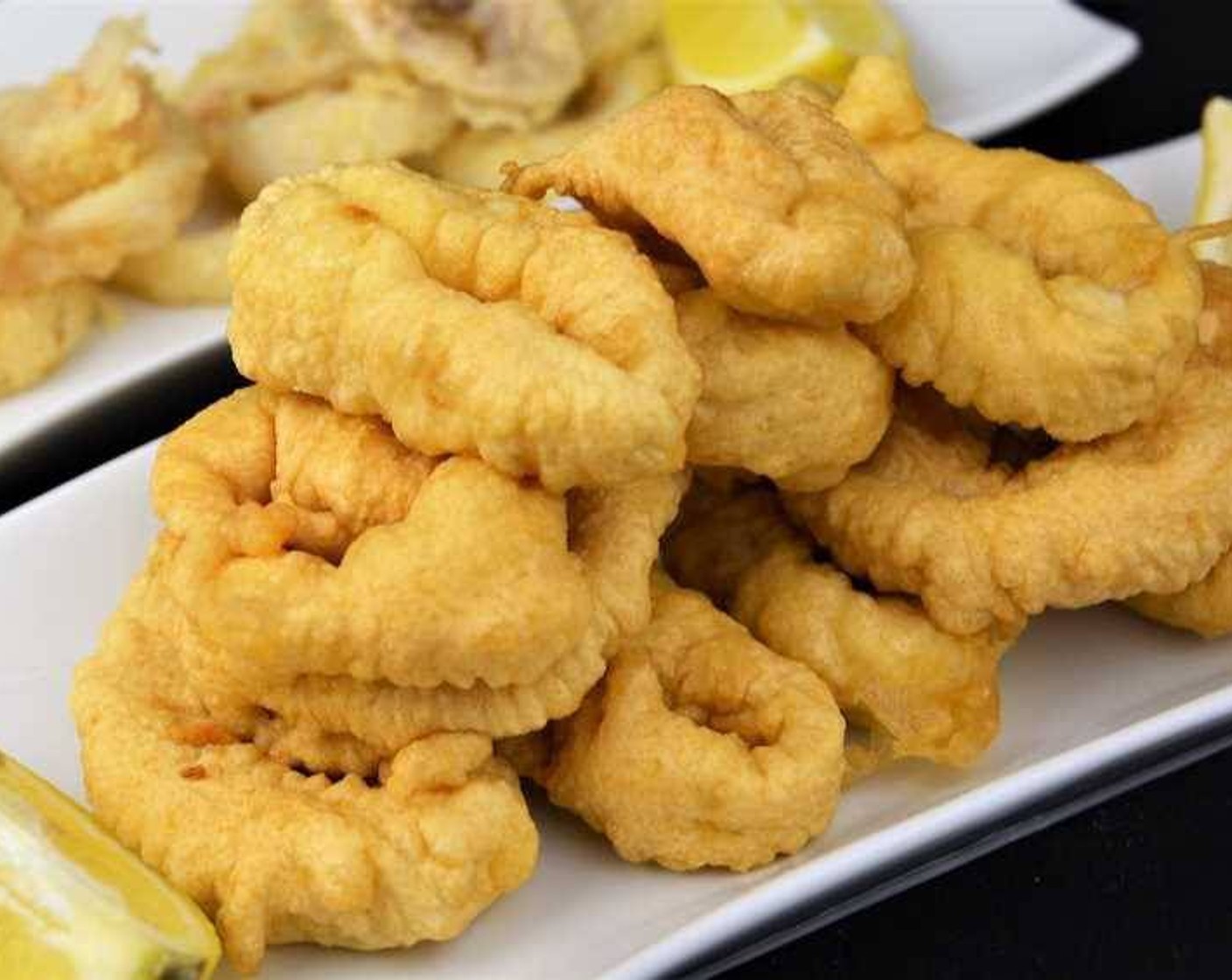 step 7 Squeeze some Lemons (to taste) on the fried calamari and they are ready! Serve and enjoy!