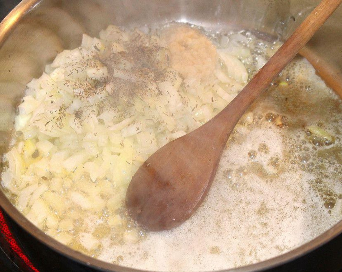 step 1 Sauté Onion (1) and Garlic Paste (1 tsp) in Butter (1/2 cup).