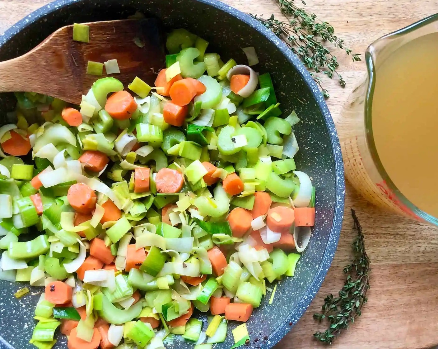 step 4 Add the prepared Leeks (2 cups), Carrot (1 cup), and Celery (1 cup) to the drippings in the pan, sauté for about 5 minutes. Stir in 1 cup of the Chicken Stock (4 cups) scraping the pan to loosen any browned bits.