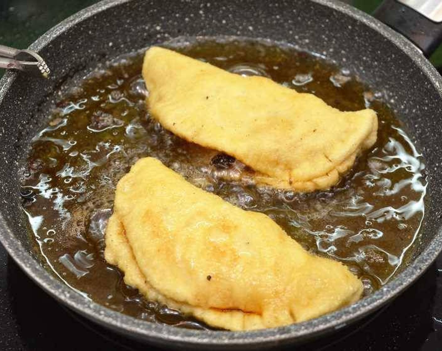 step 10 Heat up Cooking Oil (as needed) in a frying pan. Fry until golden brown, then transfer onto a plate with a paper towel to absorb the excess oil.