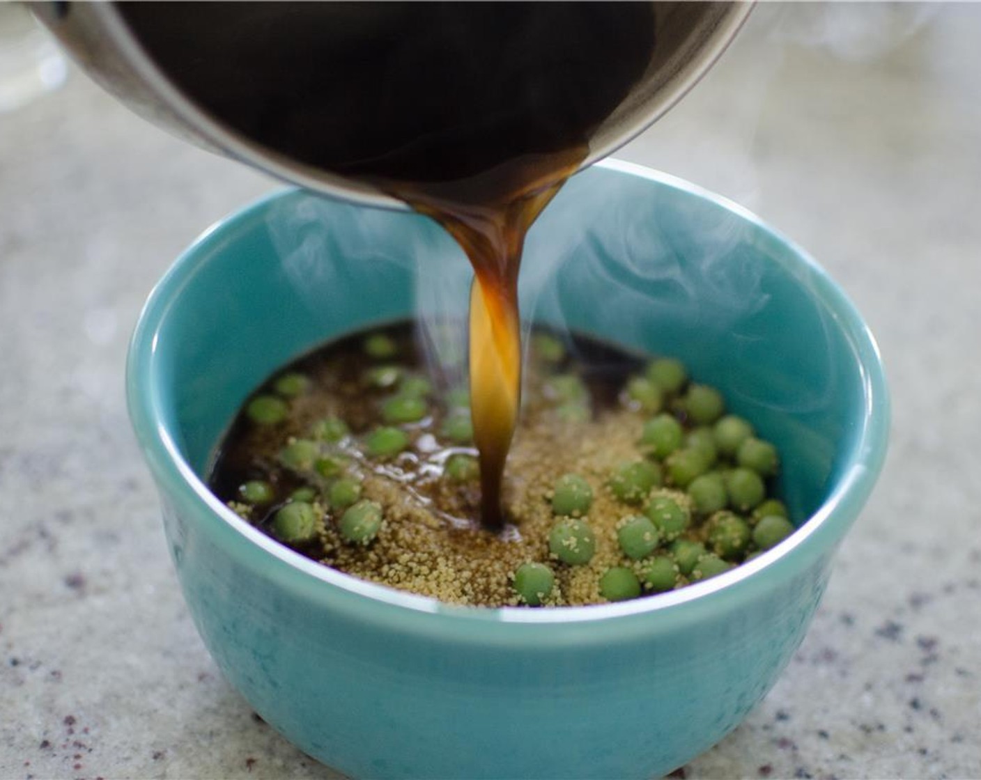 step 4 In a small pot, bring water, Chicken Bouillon Cube (1), Soy Sauce (2 Tbsp), and English Peas (2 cups) to boil for 1 min. Place couscous in a bowl. Pour boiling mixture over couscous. Cover couscous with a plate. Set aside.