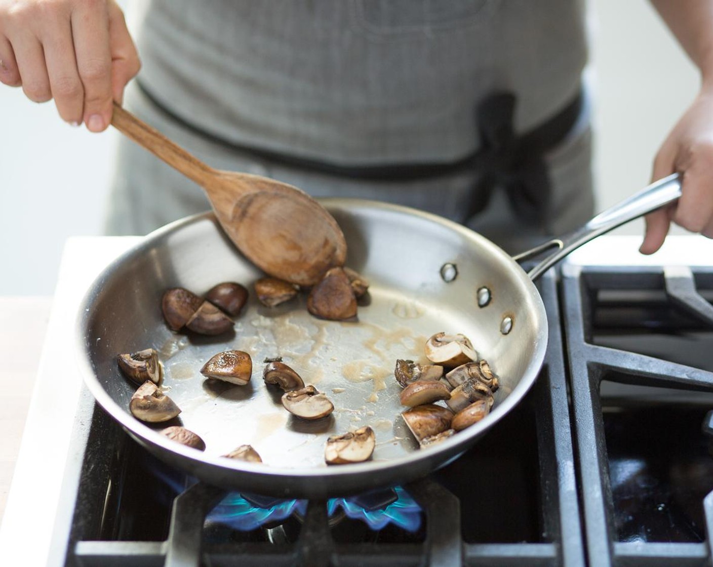 step 8 Over high heat, add Olive Oil (1 Tbsp) to the pan. When the oil is hot, add the mushrooms. Season with a pinch of Salt (to taste) and Ground Black Pepper (to taste) and sauté for 2 minutes or until tender. Remove from heat; hold. Stir Basil Pesto (1/4 cup) into the quinoa.