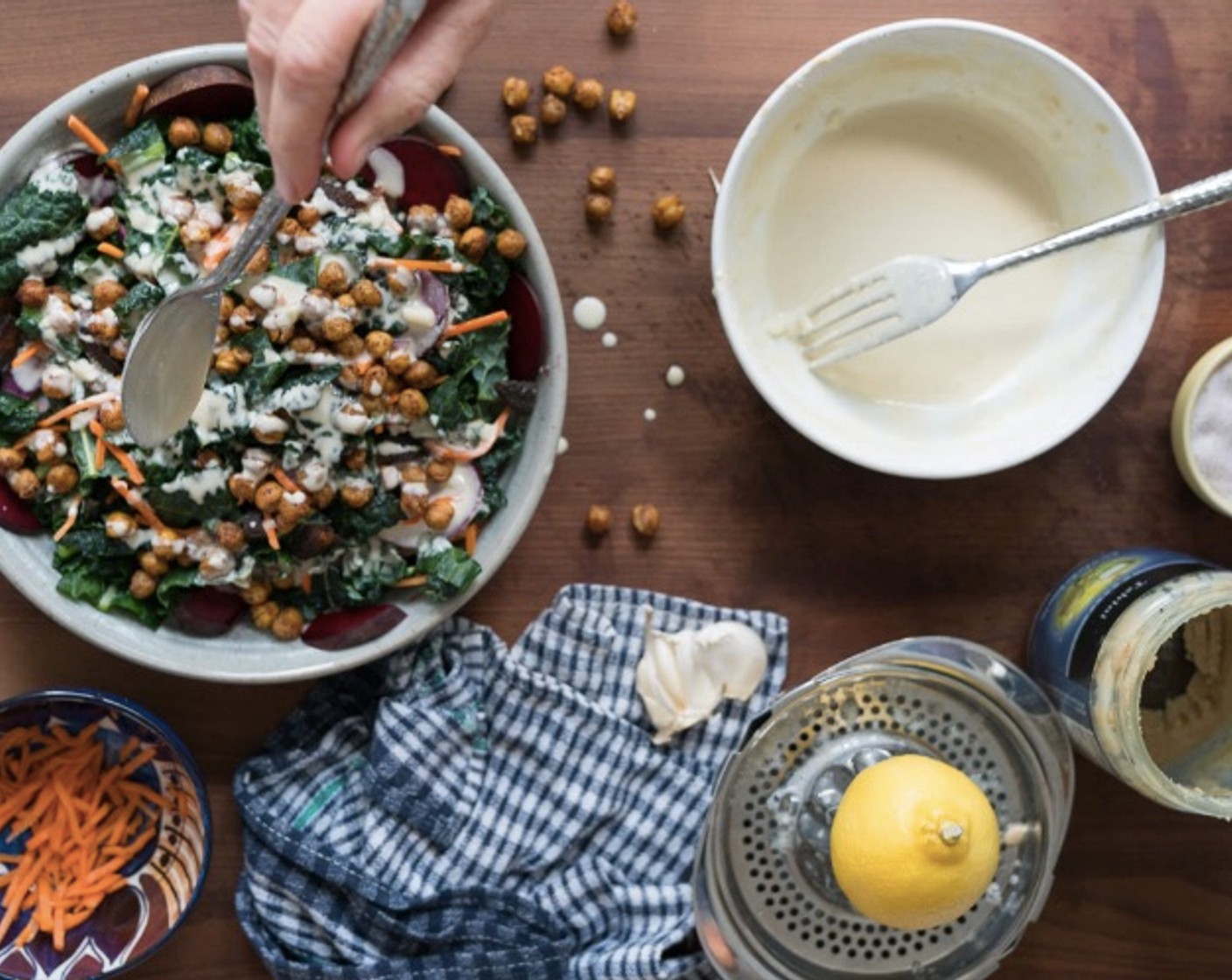 step 7 Remove the roasted chickpeas from the oven, let cool slightly, sprinkle on top of salad and drizzle dressing over top. Enjoy!