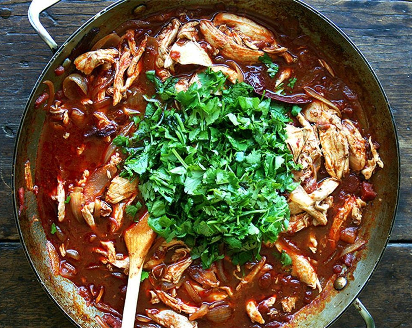 step 8 Bring the pan with the chicken to a simmer and let cook for 15 minutes over low heat. Add Fresh Cilantro (1 bunch) to the pot and stir to incorporate. Taste mixture, add more salt if necessary.