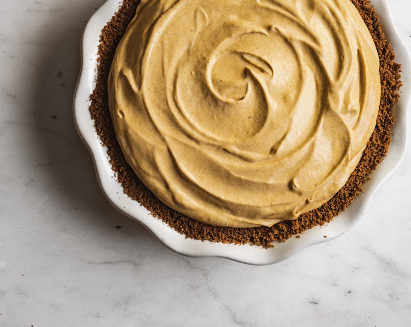 step 9 Add the pumpkin mousse mixture to your cooled pie crust and then top off with the reserved 1 cup of whipped Heavy Cream (1 cup).