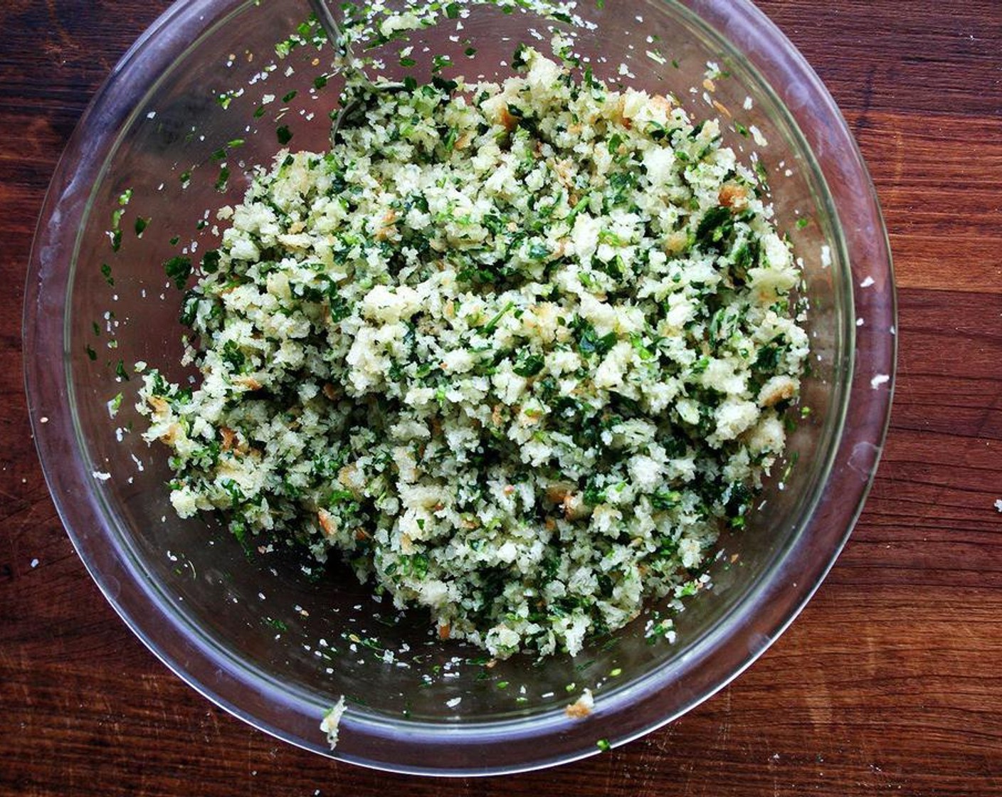 step 6 Meanwhile, melt the remaining Unsalted Butter (1/4 cup) on a stovetop or in microwave. Pulse Bread (6 oz) in food processor to make crumbs. Measure 3 cups and place in a large bowl. Add Fresh Parsley (1 bunch) and Garlic (2 cloves) to food processor. Pulse until fine, then add to bowl with breadcrumbs. Season with Kosher Salt (1/4 tsp). Pour melted butter over top and mix with spatula until combined.