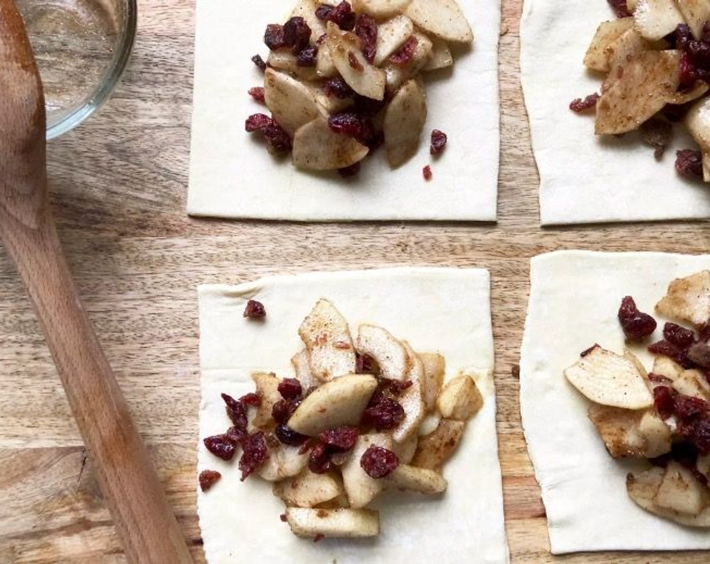 step 4 Spoon 1/4 of the pear mixture into each square.