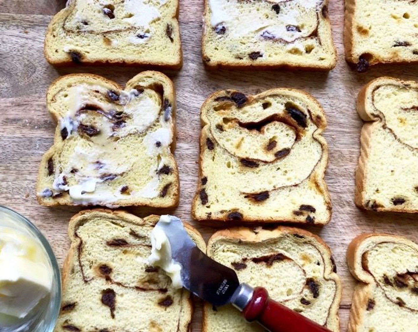 step 2 Spread half of the Cinnamon Raisin Bread (12 slices) with 1 teaspoon of Unsalted Butter (4 Tbsp) each.