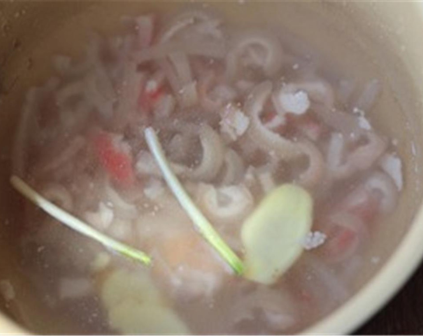 step 2 In a high pressure cooker or pot, add enough water to cover the pork rinds. Add Fresh Ginger (4 slices) and several Scallion (1 bunch) sections. Cook for at least 40 minutes for high pressure cooker and at least one and half hour for ordinary cooker. Leave the soup to cool down.