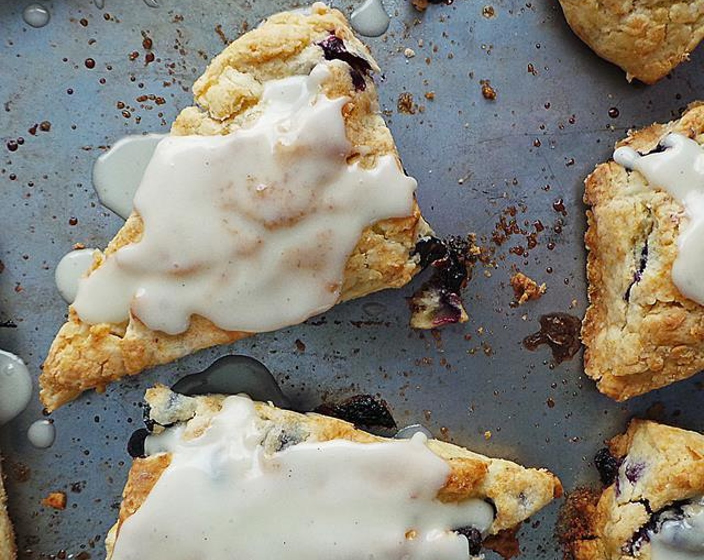 Flaky Blueberry Scones with Vanilla Infused Glaze