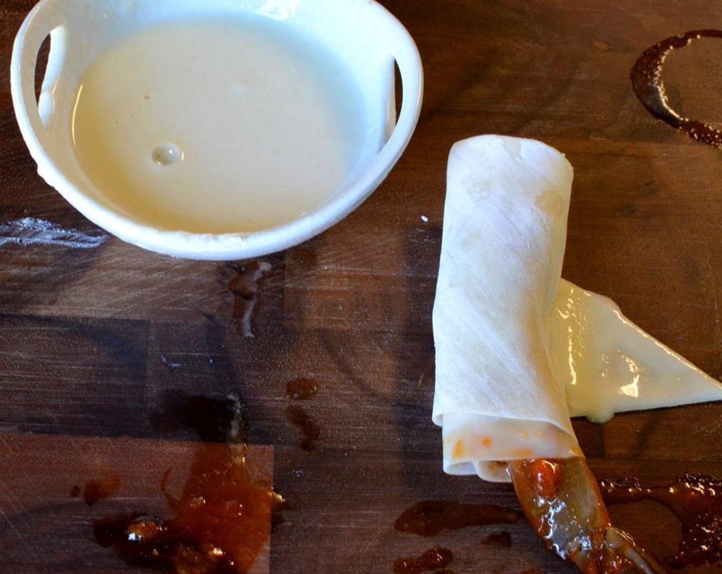 step 11 Using your finger, apply a little of the flour paste to the corner of the wrapper and seal it.