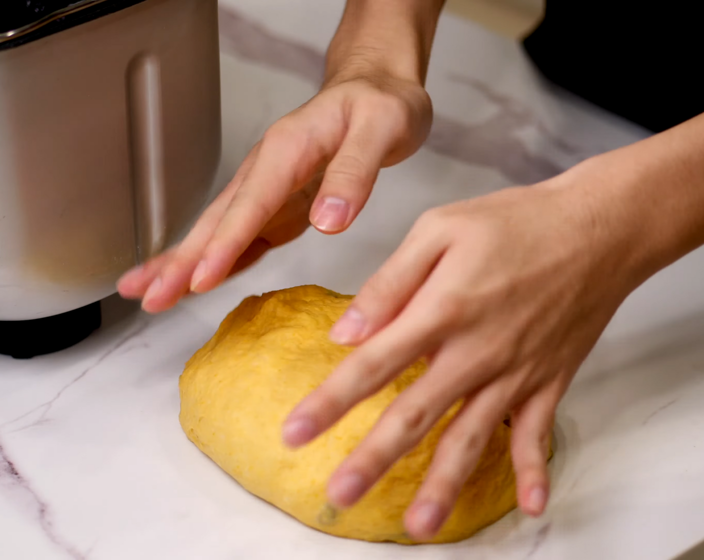 step 6 Quickly, press the dough onto a clean surface to remove all the air bubbles out and roll it into a nice smooth ball.