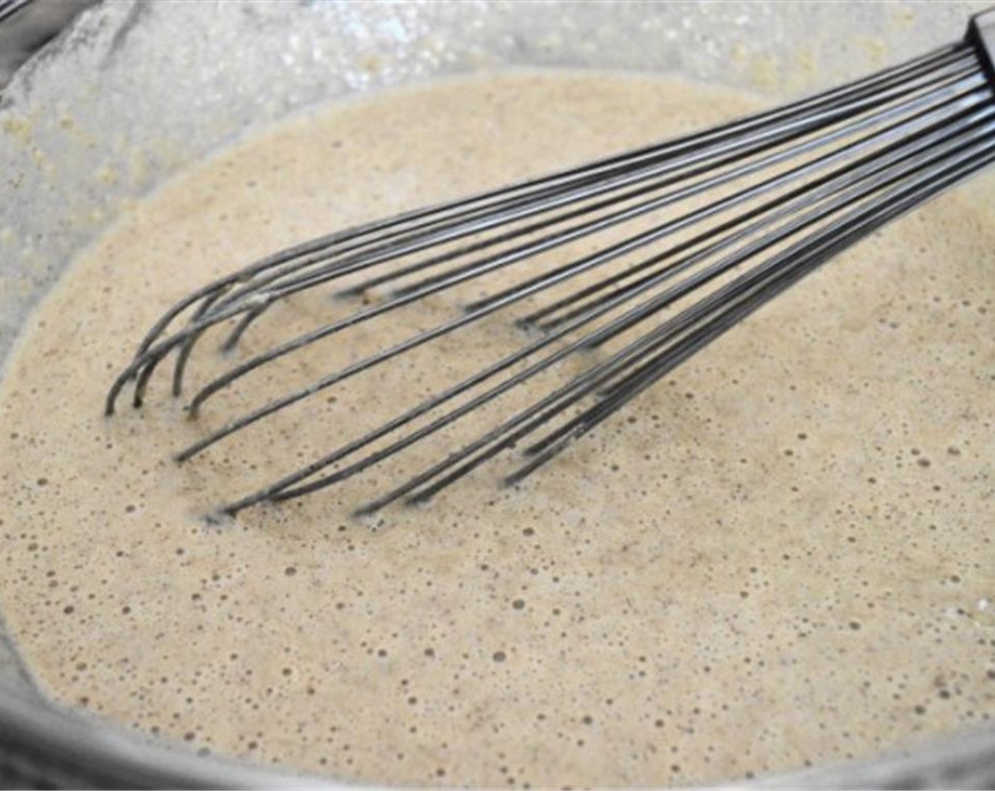 step 3 Pour the wet mixture into the bowl of dry ingredients and gently whisk it all together until you have a smooth batter.