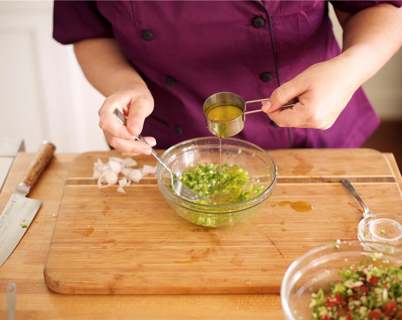 step 12 Slowly drizzle in Olive Oil (4 Tbsp) and use a fork to blend. Cut the remaining lime into 4 wedges, and set aside for garnish.