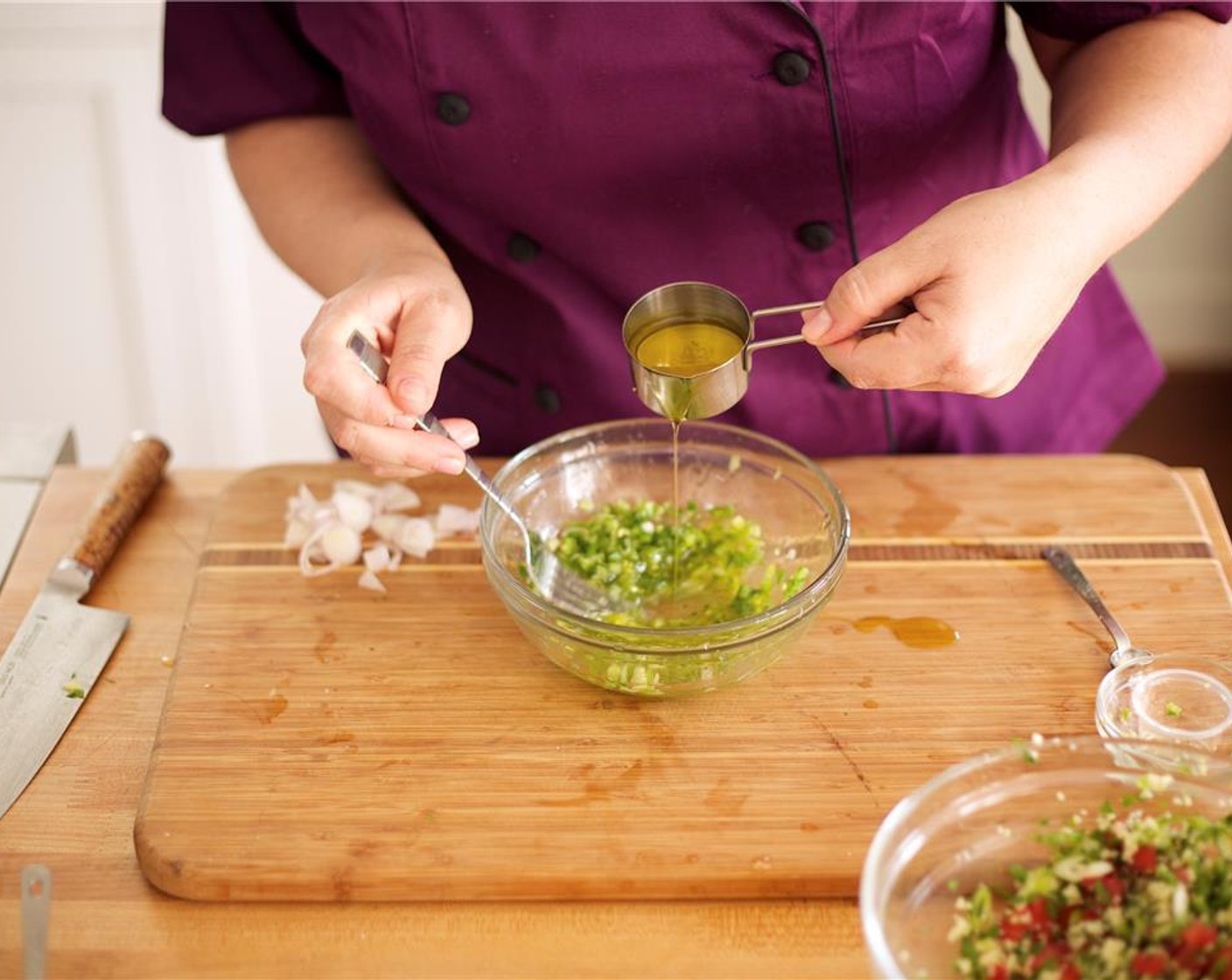 step 12 Slowly drizzle in Olive Oil (1/4 cup) and use a fork to blend. Cut the remaining lime into 4 wedges, and set aside for garnish.