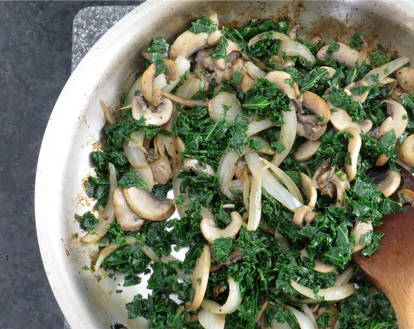 step 6 Add more Olive Oil (1 Tbsp) to the skillet, and add the Kale (3 cups). Cook 1 minute, stirring. Add Water (3 Tbsp) and cook until kale is wilted, and water has evaporated, stirring occasionally, 2-3 minutes. Add kale to onion mixture and set aside.