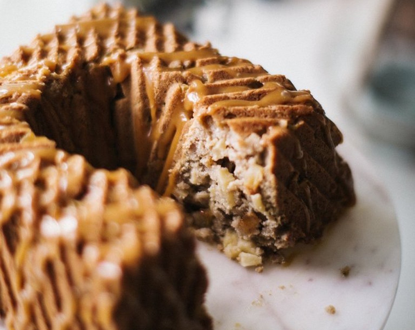 step 10 After allowing the cake to cool in the bundt pan for about 10 minutes, remove it from the pan and drizzle honey caramel over the top!