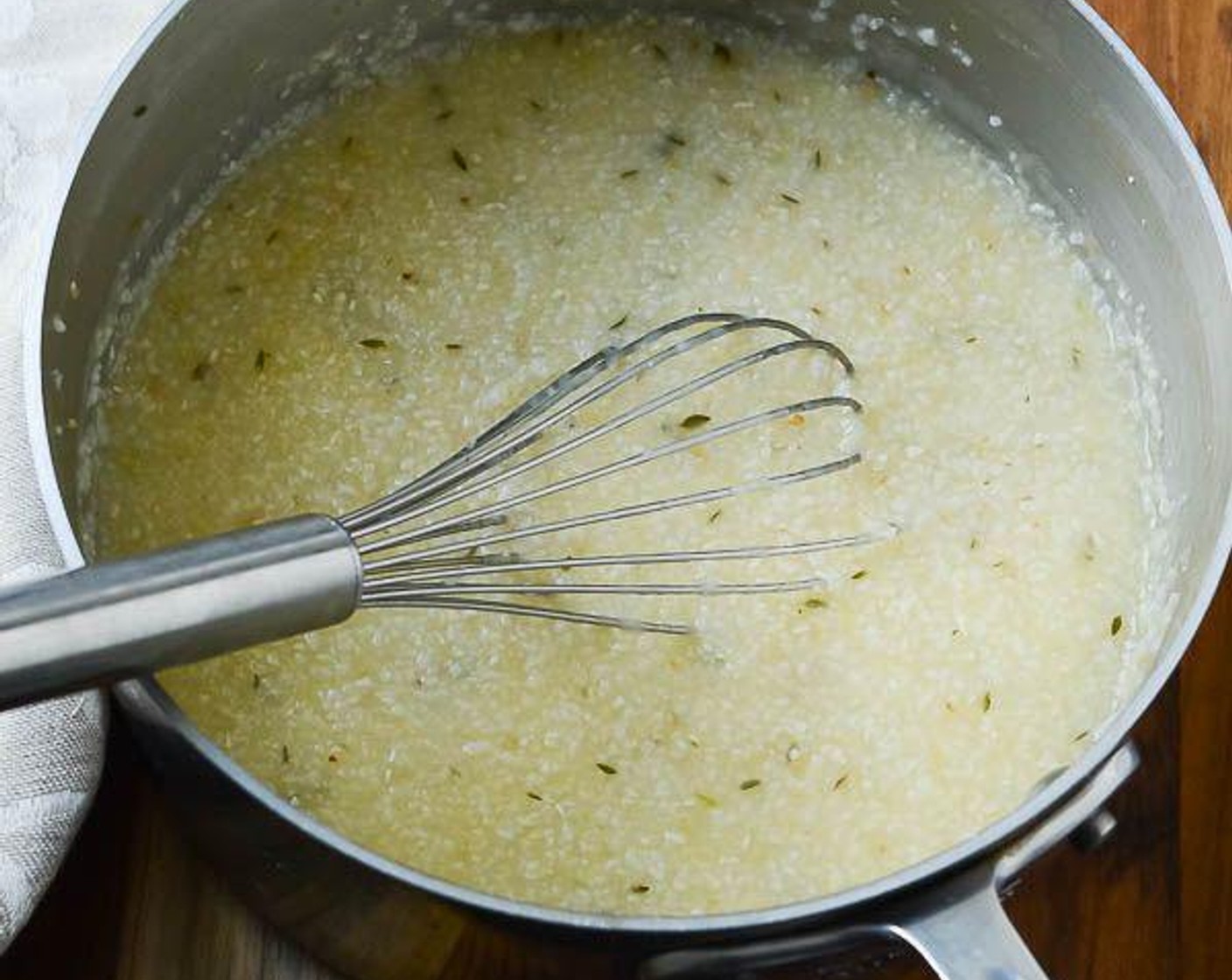 step 6 Whisk in the grits and once the liquid returns to a boil, reduce heat to low, cover and stir frequently 30-35 minutes, until thick and creamy. Be sure to scrape the bottom of the pan as the grits cook, so they don't stick.