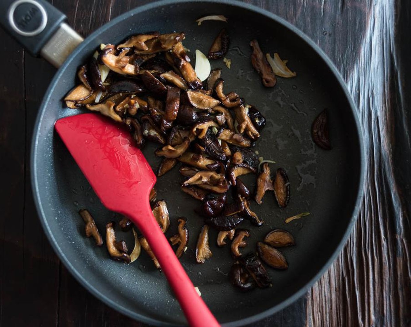 step 3 Heat Peanut Oil (2 Tbsp) in a medium size pan over medium heat until warm. Add shiitake mushrooms. Cook and stir until both sides turns golden, 3 to 5 minutes.