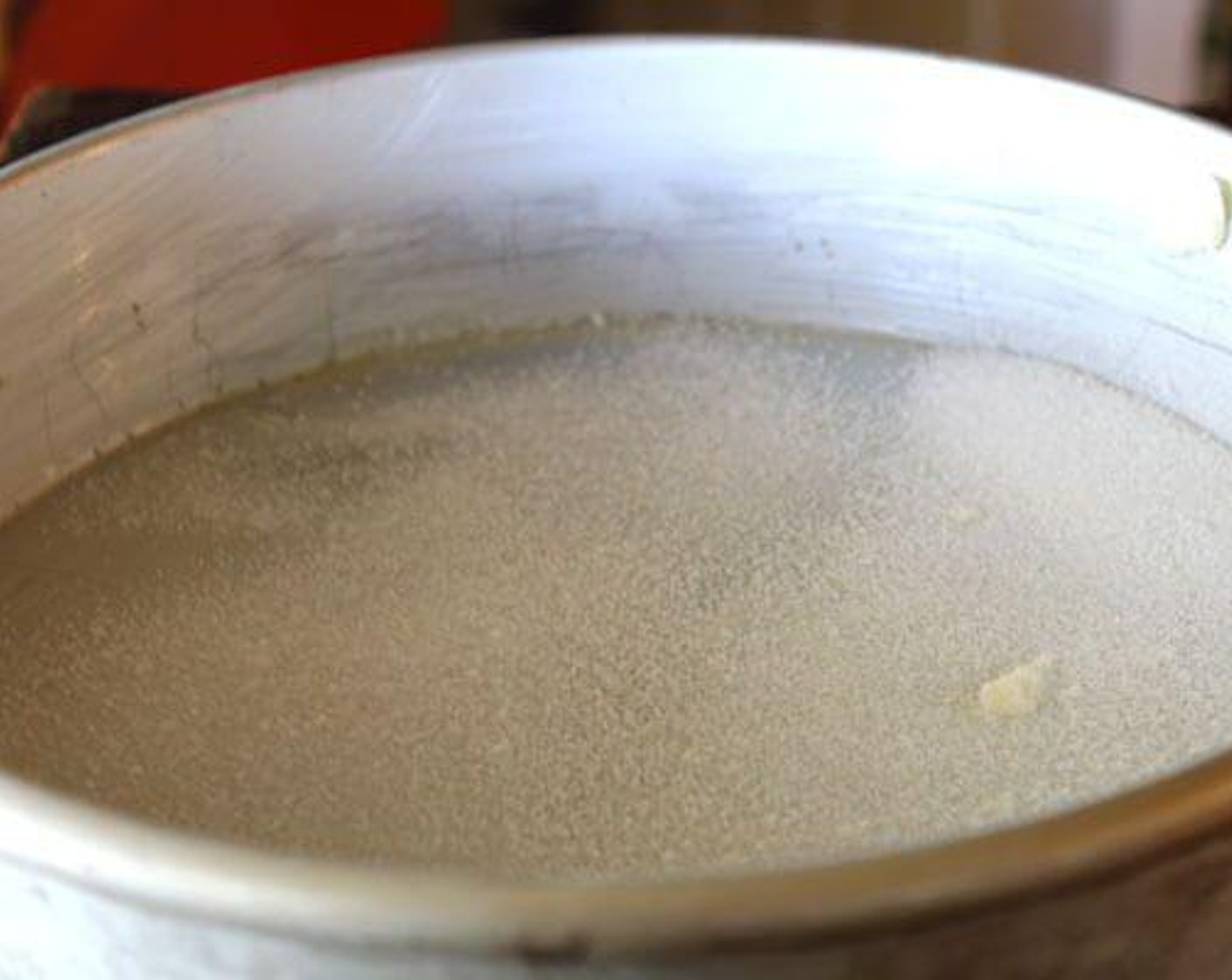 step 2 Prepare three 8 or 9-inch round cake pans with Butter (to taste) and Granulated Sugar (to taste).