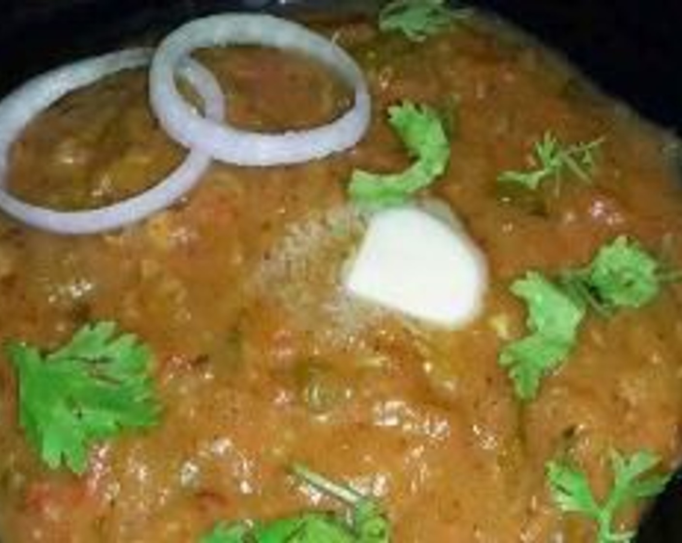 step 10 When done, garnish with Fresh Cilantro (1 Tbsp). Serve with Onion (1) and Lemon (1).