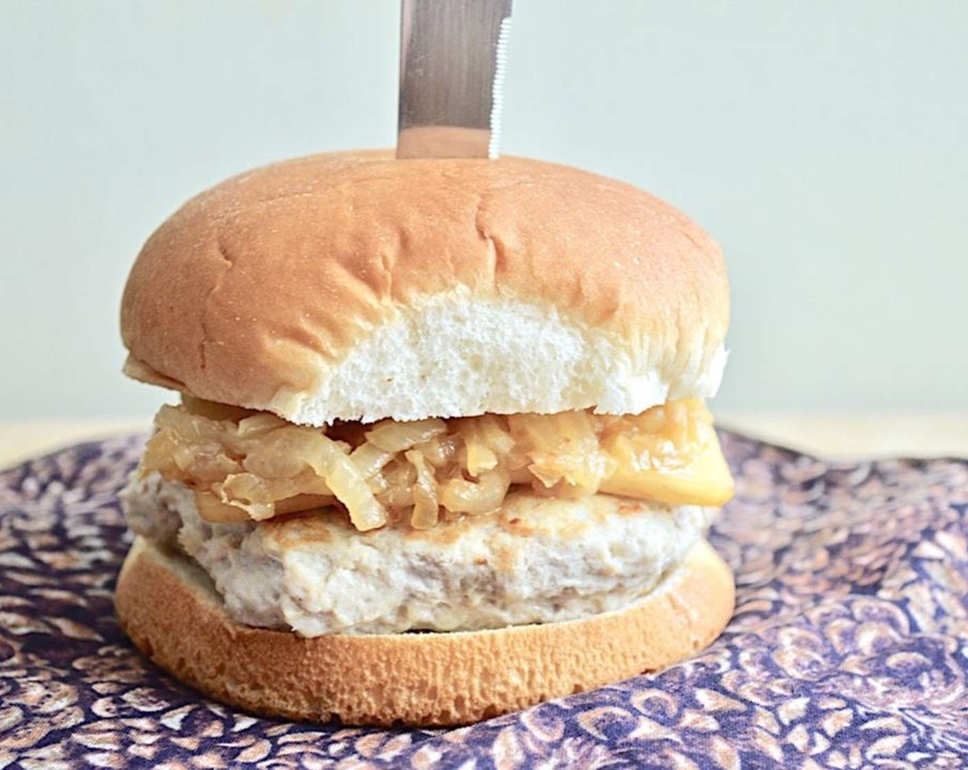 step 7 When the burgers are done, place them on the Hamburger Buns (6) and top them all with a generous heap of the caramelized onions. Finish with desired toppings. Serve immediately with your favorite sides and enjoy!