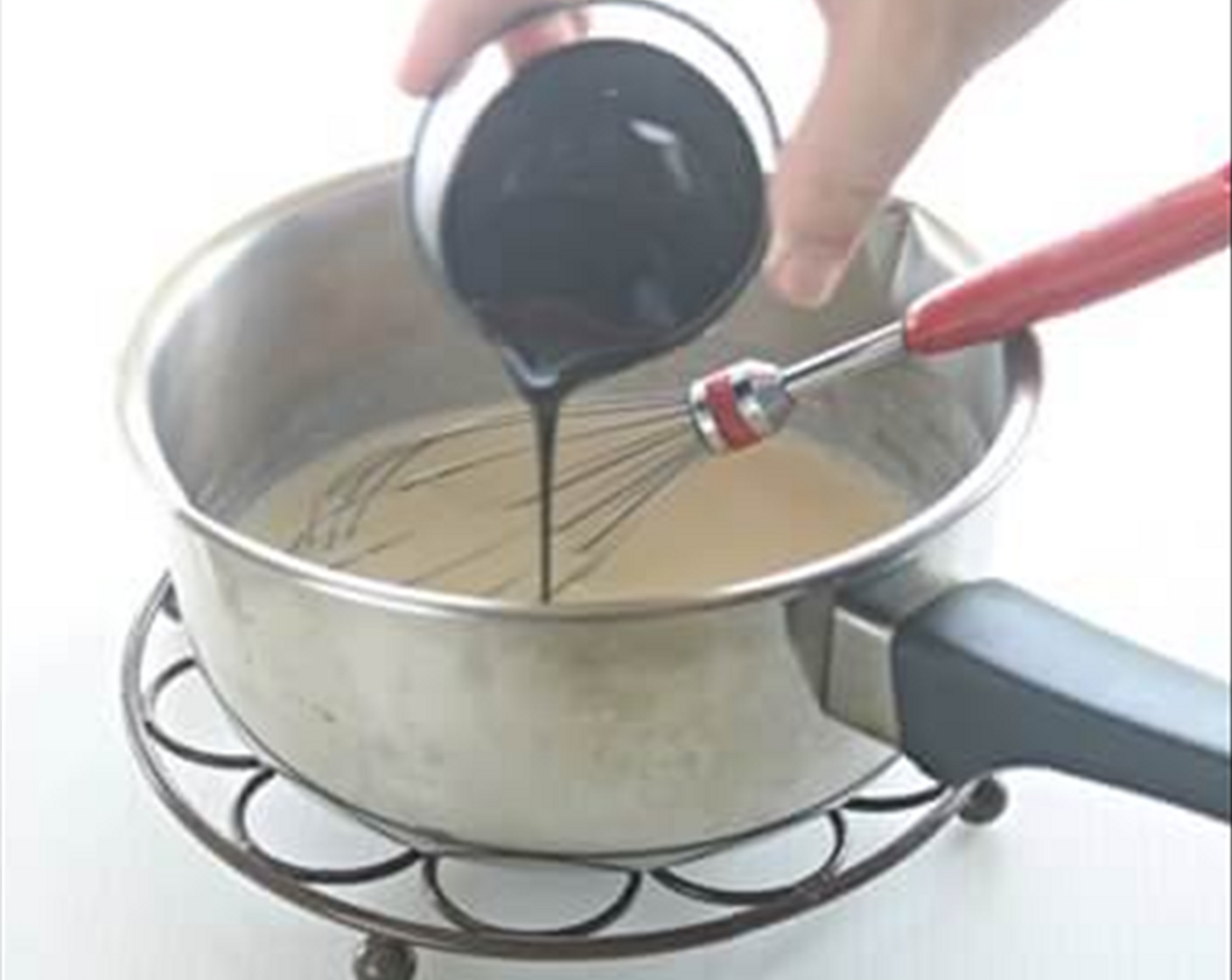 step 3 Stir in Black Sesame Paste (2 Tbsp) and cool down liquid a little.