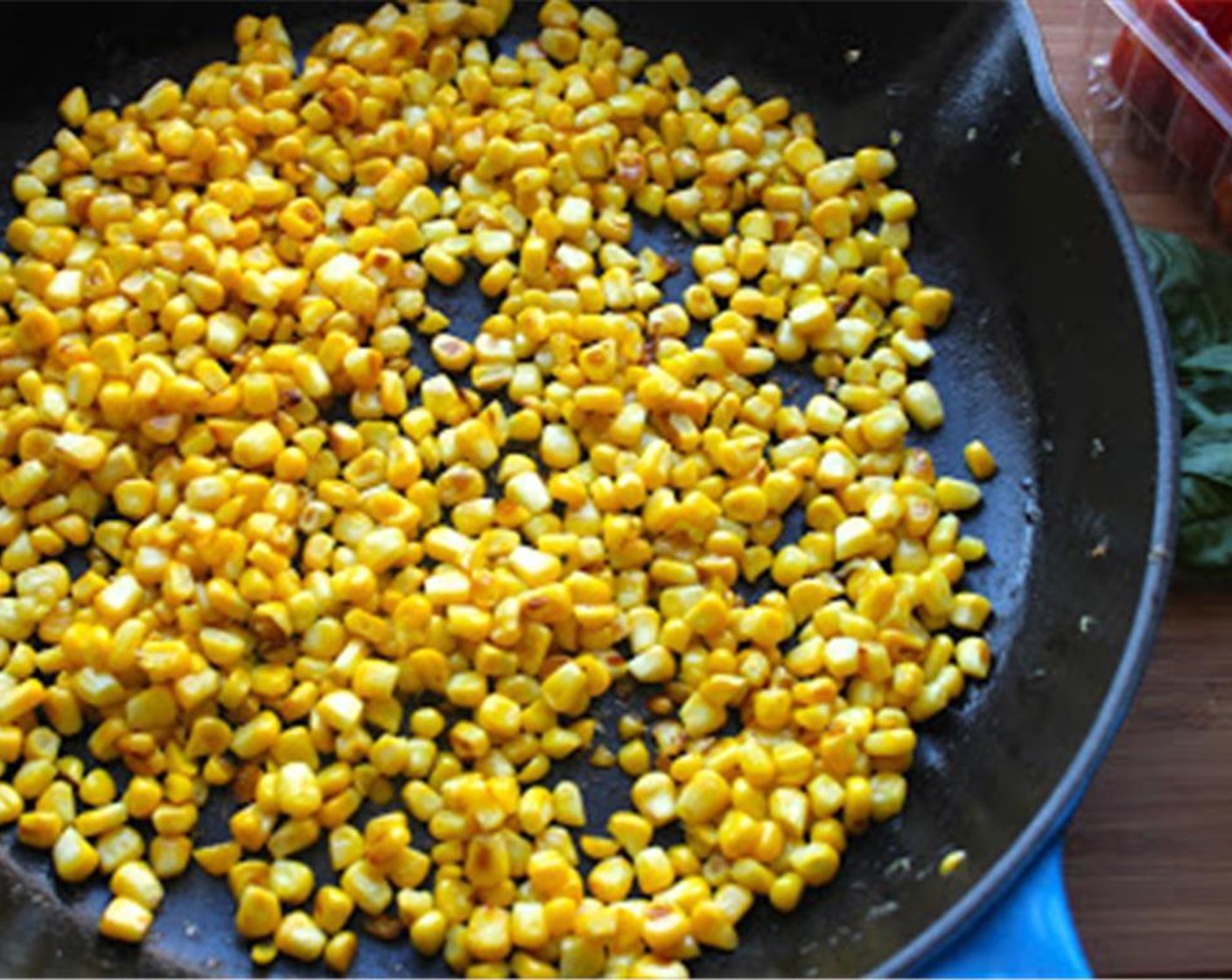 step 2 Heat 1 tbsp Extra-Virgin Olive Oil (1 Tbsp) in a cast iron skillet. When hot, add the corn and sauté for 8-10 minutes until the corn is tender and well browned. Transfer the cooked corn to a large mixing bowl and let cool to room temperature.