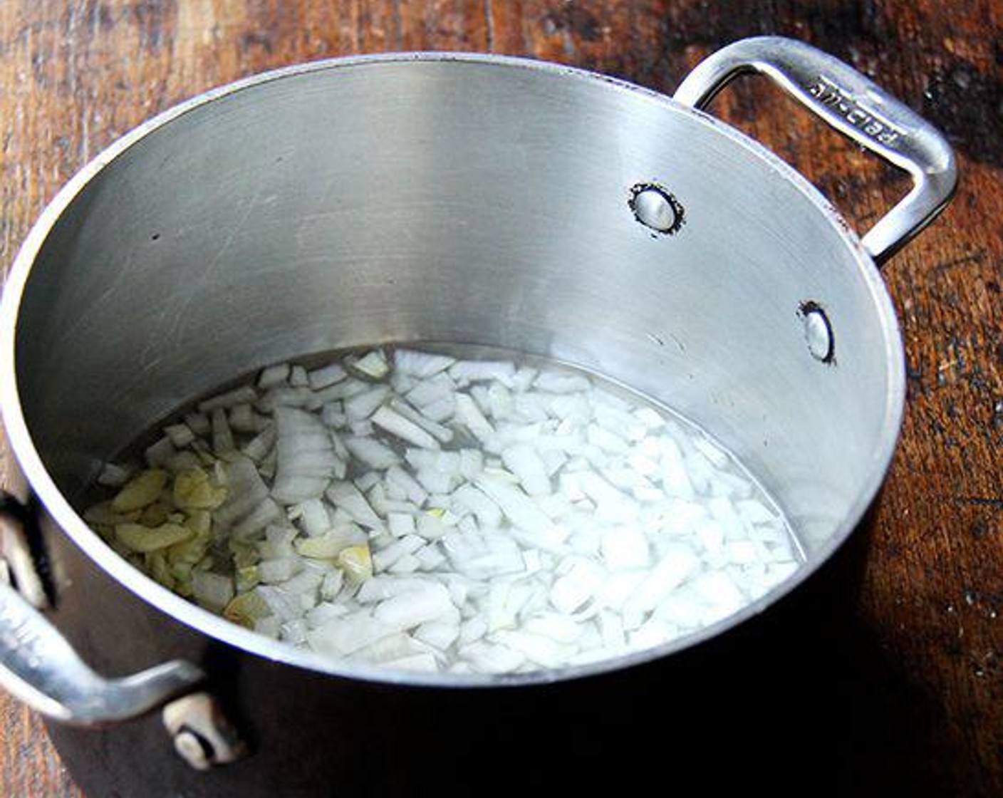 step 1 Heat a medium-size saucepan over low heat. Add the White Onion (1/2), Garlic (1 clove) and Water (1/2 Cup). Cook until the onions and garlic are softened, being careful not to let them burn, 5 to 7 minutes — the water will be nearly evaporated.