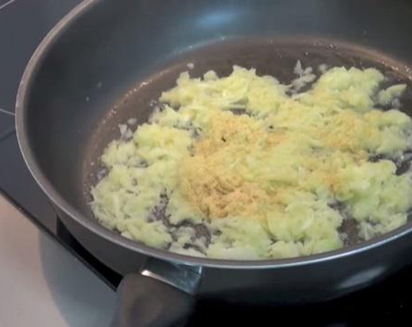 step 1 On a frying pan over medium heat, cook together the Olive Oil (1 Tbsp), grated Green Apple (1), White Onion (1) until the onion is softened.