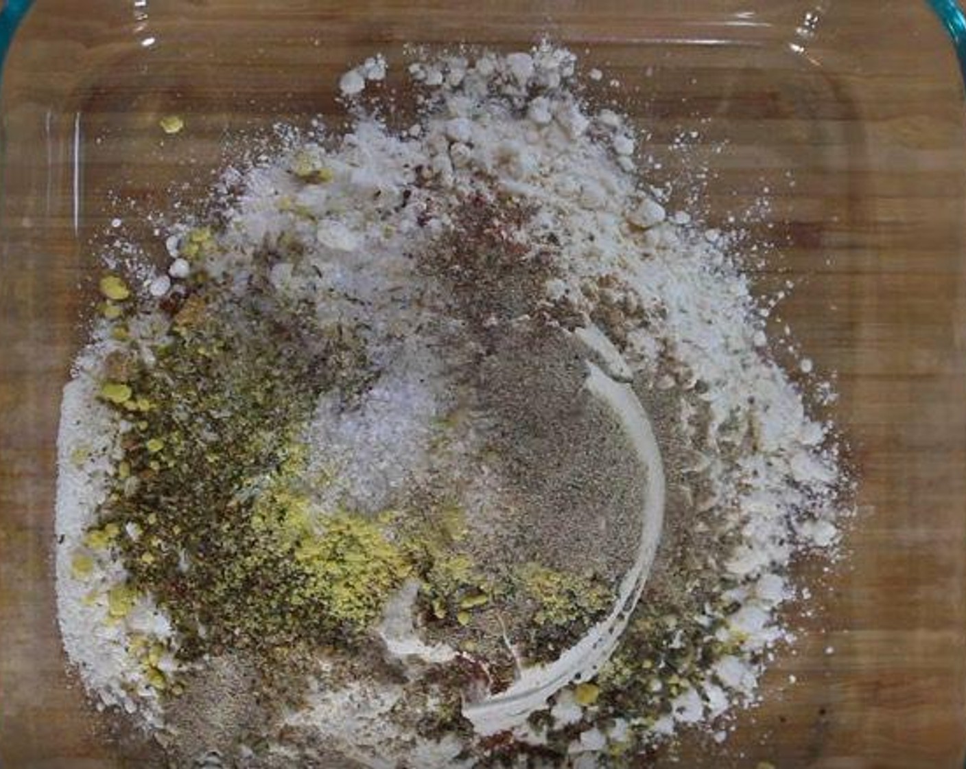 step 3 Into a baking dish, add All-Purpose Flour (1 cup), Dried Thyme (1/2 tsp), Paprika (1/2 Tbsp), Ground Ginger (1/2 tsp), Garlic Salt (1 tsp), Dried Basil (1/2 tsp), Dried Oregano (1/4 tsp), Celery Salt (1/2 tsp), Dry Mustard (1/2 tsp), and Ground White Pepper (1/2 tsp), and {@10:}. Mix well.