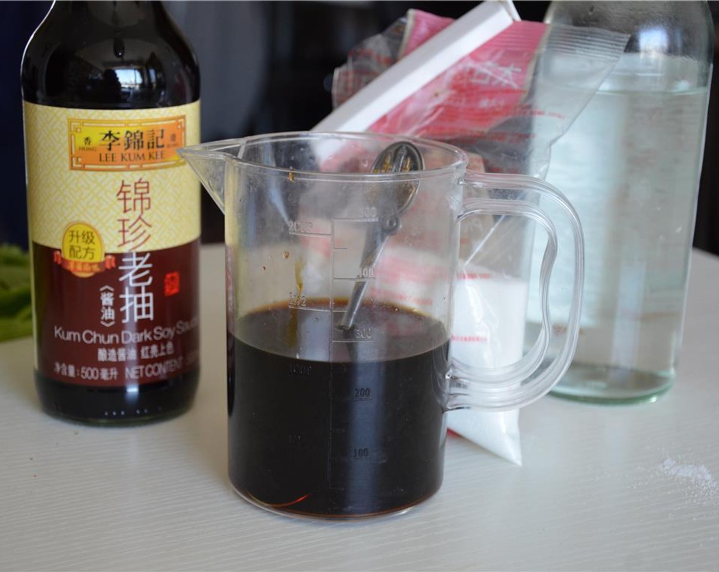 step 5 Stir together Water (1 cup) and Lee Kum Kee© Dark Soy Sauce (1 Tbsp).