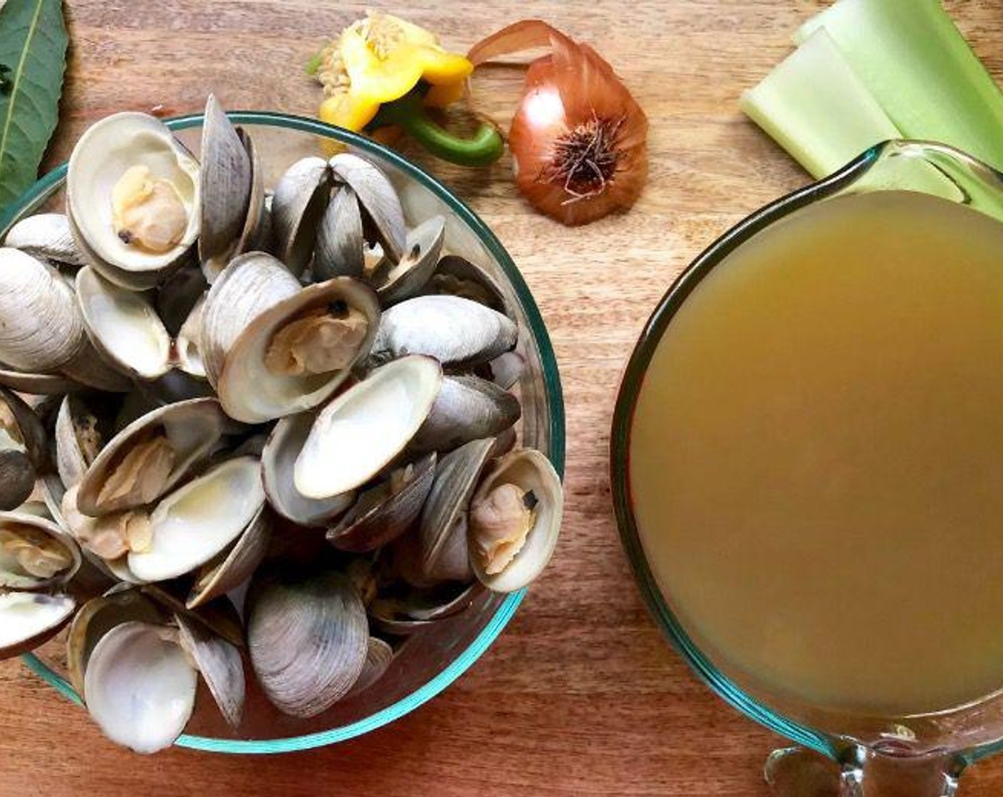 step 2 Toss any that stay closed. Use a slotted spoon to transfer the clams to a bowl and set aside. Strain the broth through a fine-mesh sieve into a heatproof bowl. Pour very slowly. If there is any remaining sand, it will linger at the bottom. Toss that and rinse the pot.