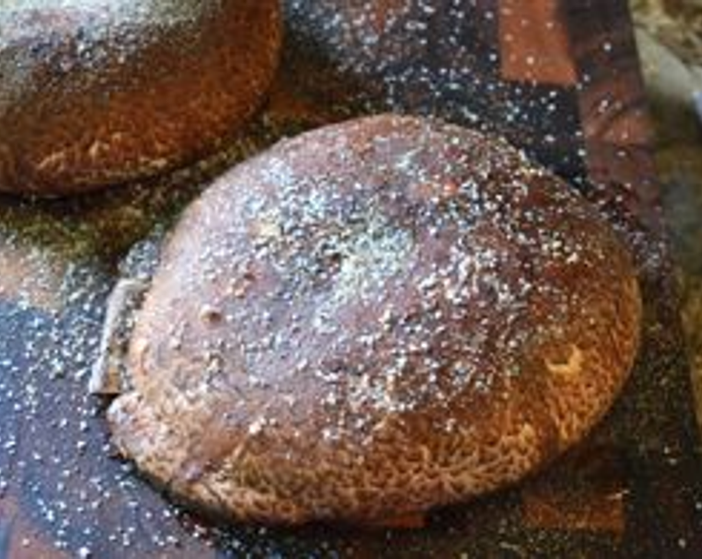 step 4 Season the mushroom well on both sides with Salt (to taste), Ground Black Pepper (to taste), and McCormick® Garlic Powder (to taste).