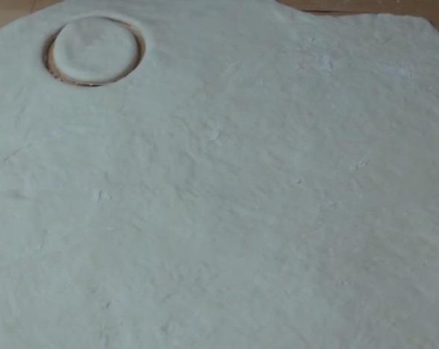 step 4 Using any circular object(like a glass), cut circular pieces out from the dough