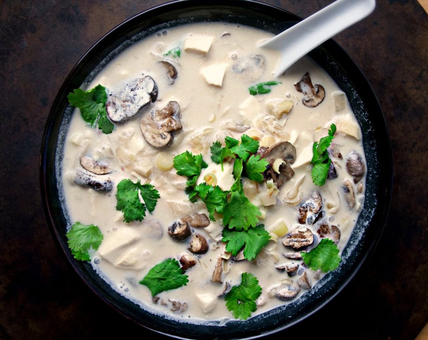 step 8 Serve hot and topped with Fresh Cilantro (1/2 cup). Careful not to eat the lemongrass and ginger chunks at the bottom of the bowl! Enjoy!