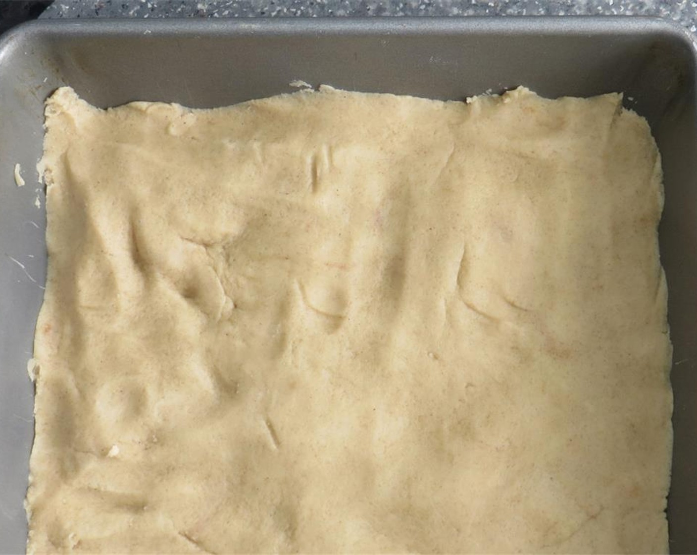 step 5 Press dough into bottom of a prepared baking dish. Bake until crust is pale golden, 25 to 30 minutes. Let cool.