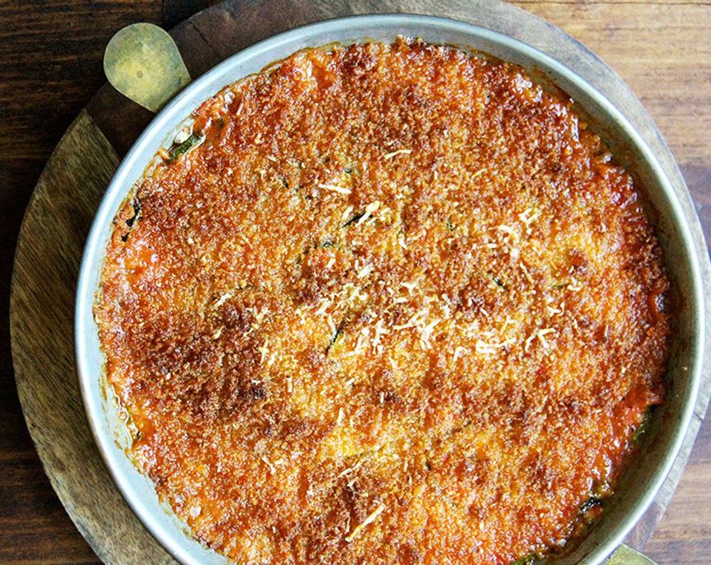 step 7 Top with the breadcrumb mixture. Bake until the mixture is bubbly and top is golden, 25 minutes or so depending on size of pan and thickness of layers.