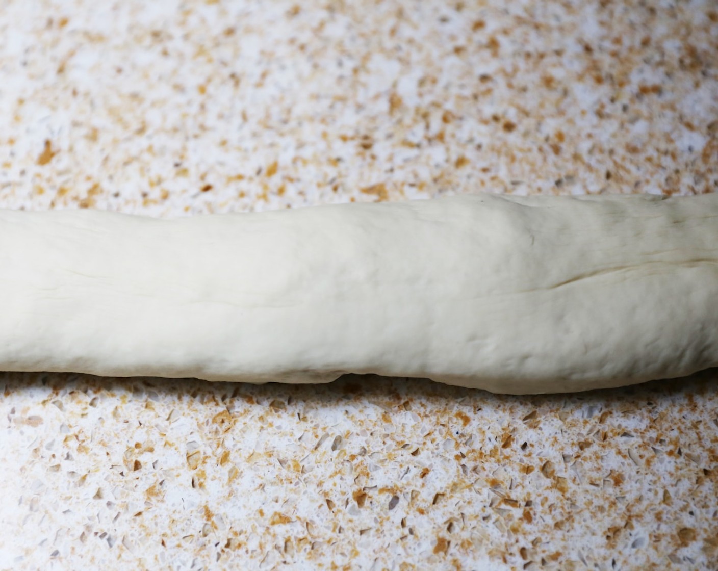 step 8 Roll out the dough into a long sausage, around 3cm thick.