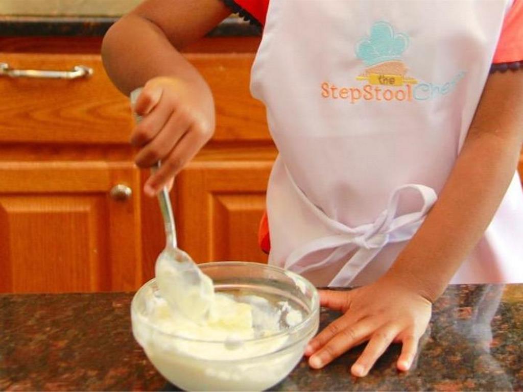 Step 1 of Confetti Dipped Strawberries Recipe: Mix Honey (1 tablespoon) and Greek Yogurt (5.3 ounce) in a small bowl.