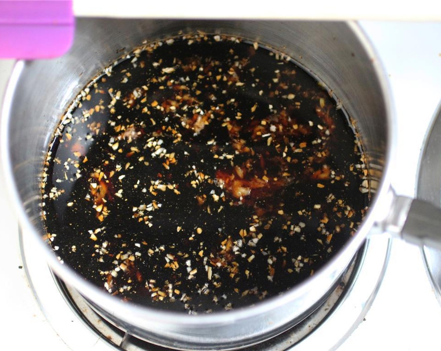step 2 In a medium saucepan over medium heat, combine the Soy Sauce (1/2 cup), Ground Ginger (1 tsp), minced Garlic (1 clove), Minced Dried Onion (1 tsp), Water (4 Tbsp) and Brown Sugar (2 Tbsp). Stir until sugar is melted and incorporated.