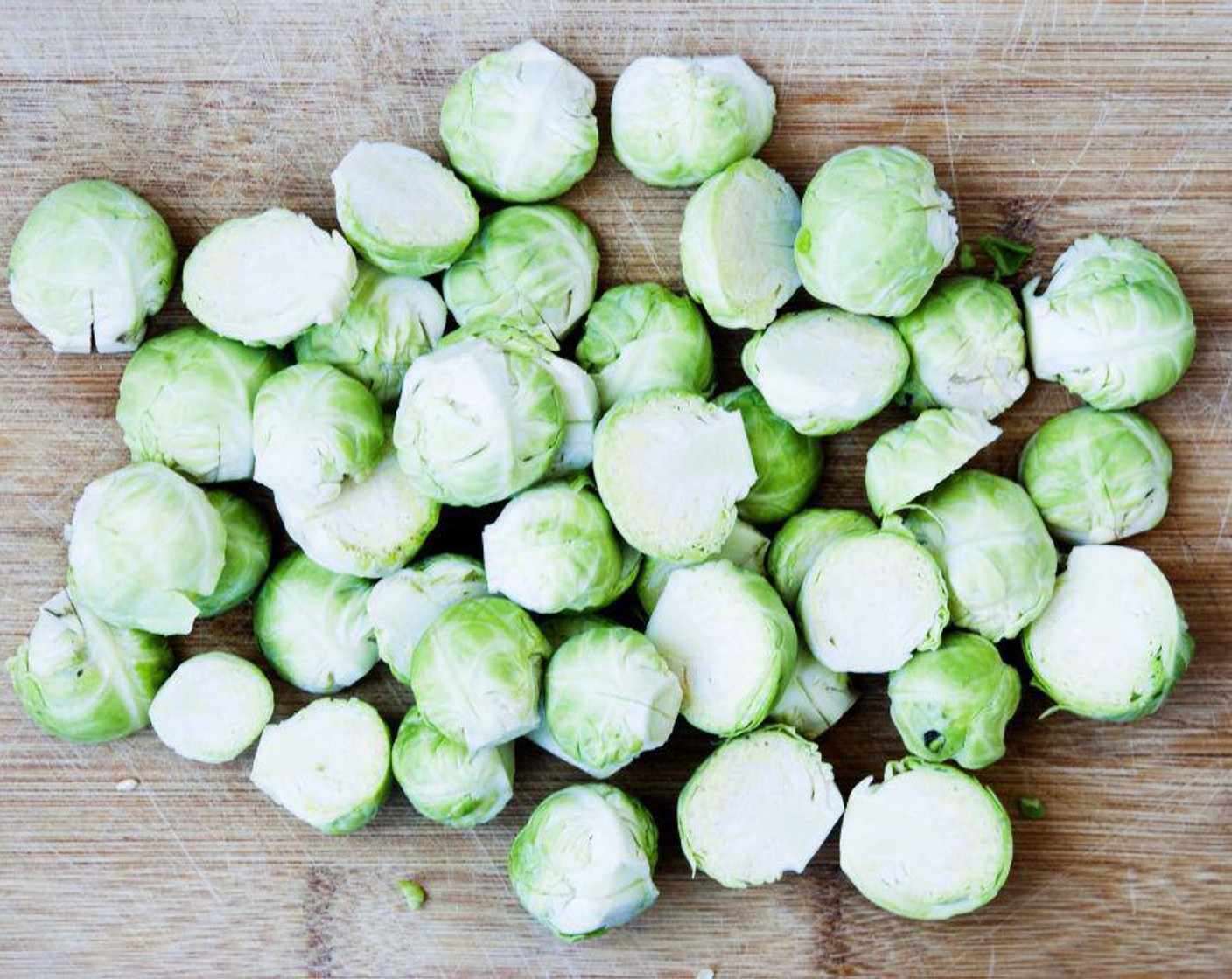 step 2 Wash and cut Brussels Sprouts (2 cups) in half.