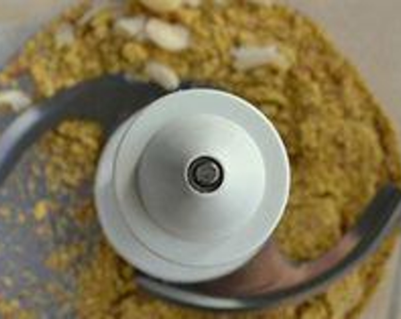 step 2 Give Almonds (1/2 cup) a quick blitz in your food processor. Now add the Garlic (2 cloves), Salt (to taste), Ground Black Pepper (to taste), Granulated Sugar (1 tsp), and Lime (1). Pulse just enough to mix them.