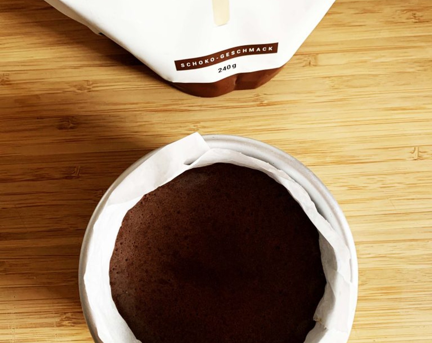 step 3 Next, prepare the ice cream. In a food processor pulse Bananas (1 2/3 cups), Cacao Powder (4 Tbsp), and Peanut Butter (4 Tbsp) until it gets creamy but not watery. Pour the ice cream on the base and place it in your freezer for 4 hours.