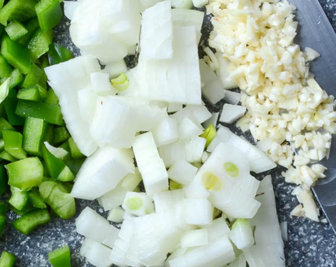step 5 Add the  diced Green Bell Pepper (1 cup), minced Garlic (1 clove) and diced Onion (1 cup) and and cook, stirring several times, until the vegetables are tender and slightly translucent, about 5 minutes.