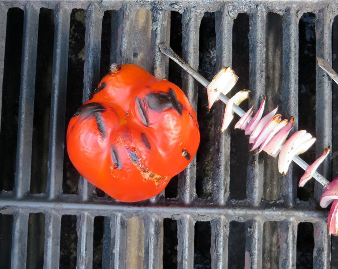 step 4 Place the Red Bell Pepper (1) directly on the grates and cook until well charred. If using an oven, heat it to 450 degrees F (230 degrees C), and place the red pepper in the oven and cook for 30 minutes or until tender.