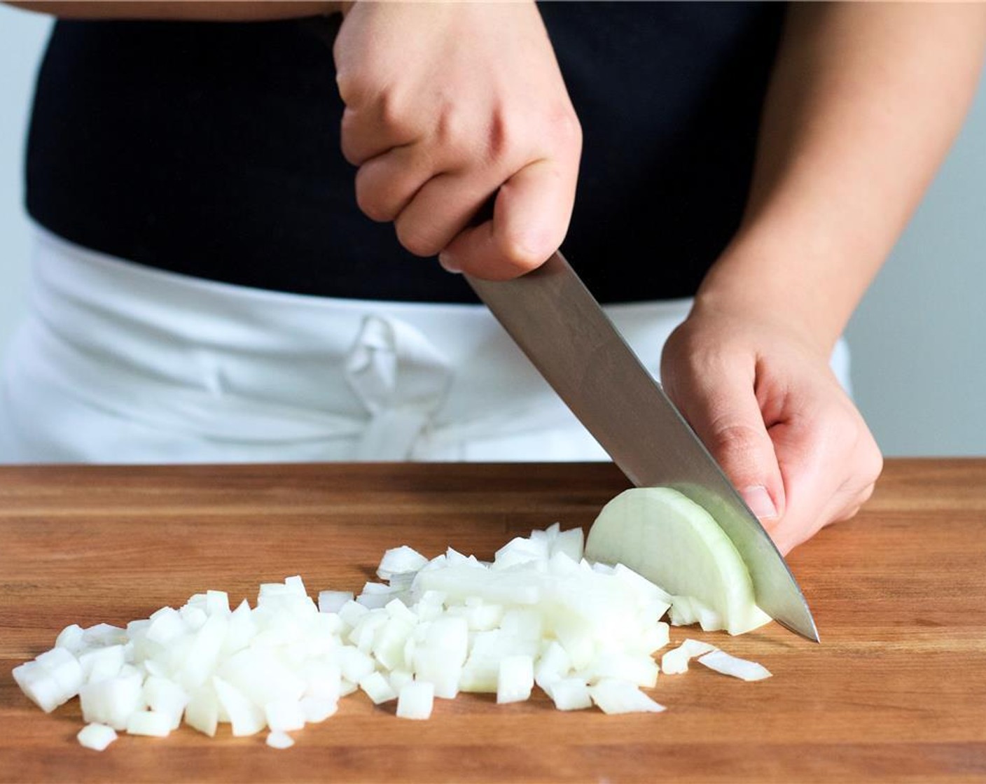 step 3 Mince Garlic (2 cloves) and divide in half. Peel and cut half a cup of the Sweet Onions (2) into quarter inch diced pieces, and set aside. In a small bowl, mix together one and a half cups of water and Chicken Base (1 pckg).