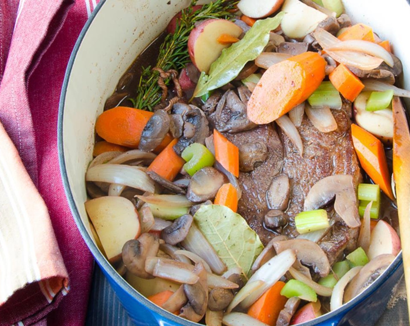 step 7 Add the Carrots (4), Celery (2 stalks), and Red Potatoes (4), thyme bundle and Bay Leaves (2).