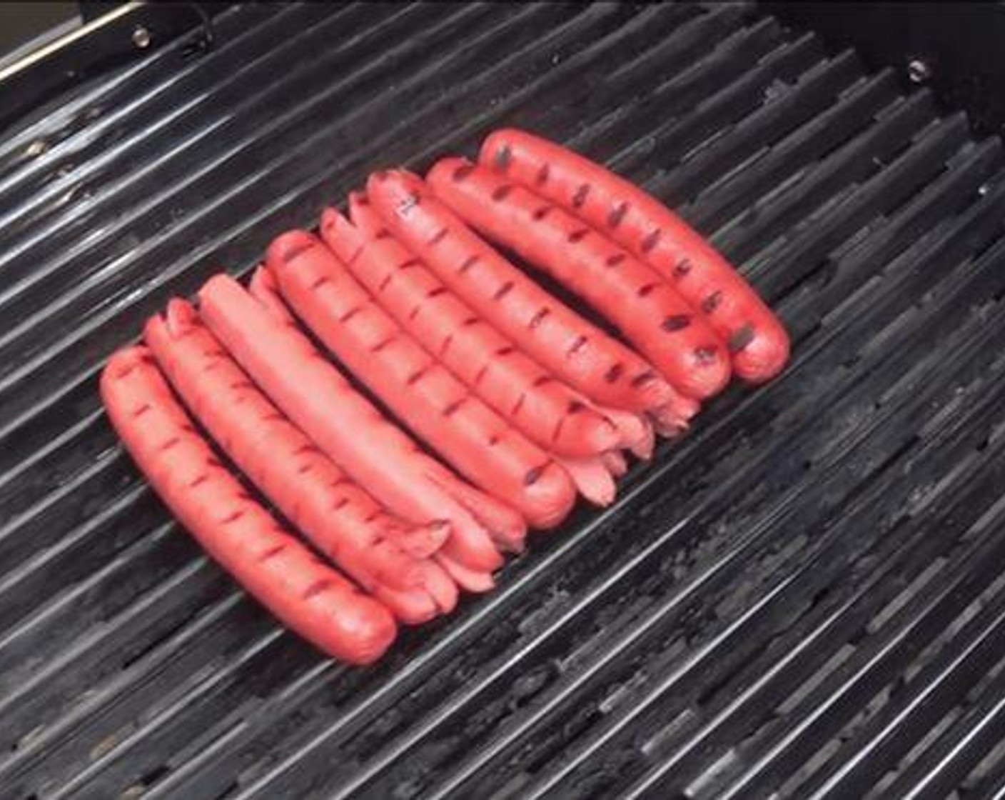 step 1 On a hot grill place your Hot Dogs (6) on for 5 minutes. When they have great grill marks on the hot dogs you can pull them off.