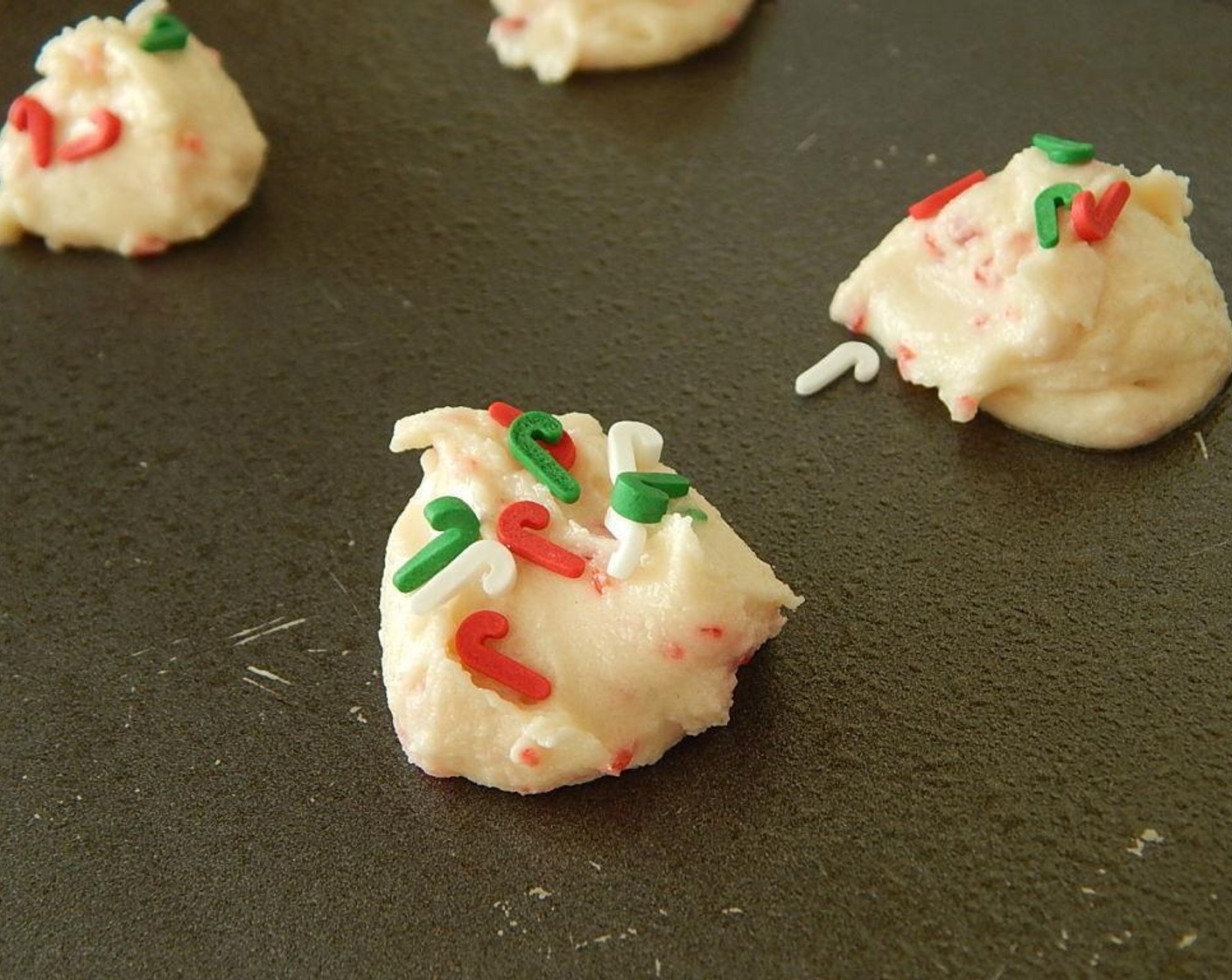 step 5 Drop a teaspoon onto cookie sheet, keep them small. Top with Candy Cane Sprinkles (to taste), if desired, before putting it in the oven. Bake for 6 to 8 minutes.